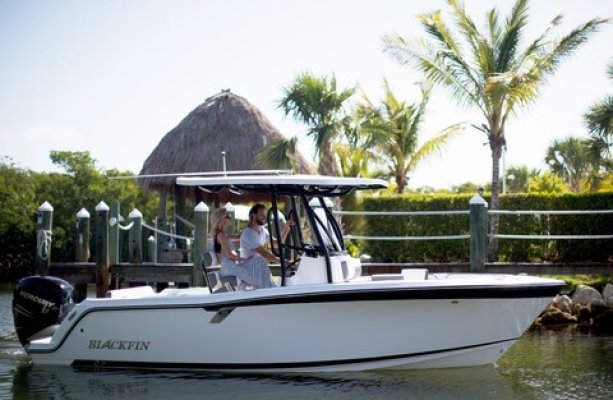 A Blackfin speed boat docking at a beach in Hawaii